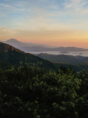 Fototapeta premium Sunset view from the mountains in Gocek, Turkey - beach town of Fethiye below