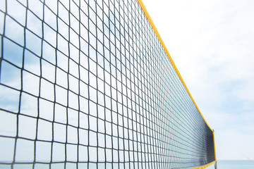 volleyball net on beach.