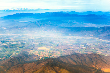 Fields and town on the foot of the mountain
