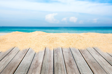 wooden terrace with sand beach and tropical sea.