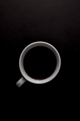 Black coffee on black color background