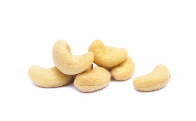 Roasted salted cashews isolated on a white background.