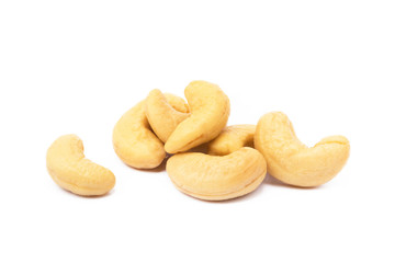 Roasted salted cashews isolated on a white background.