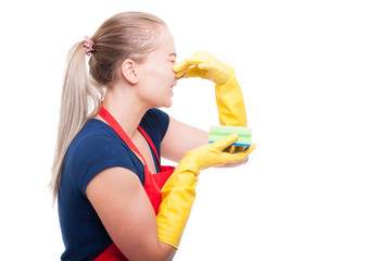 Maid woman with stinky cleaning sponge