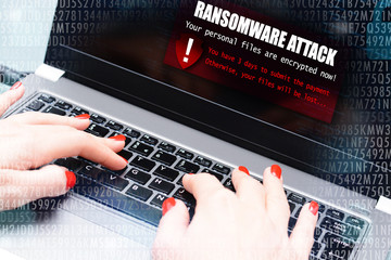 Ransomware virus attack message blocking a user to access data on computer