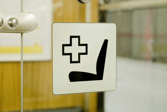 Interior Of Munich Metro Wagons, U Bahn, Close-up Of Seat Symbol Reserved For People With Motor / Health Problems, Leather Seats, Lights, And Blurry People, Munich, Germany