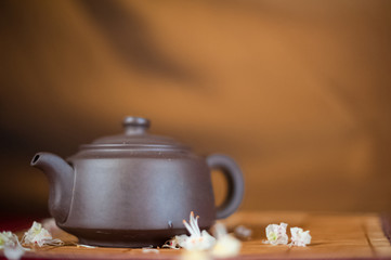  Chinese tea-kettle on a gold background. Chestnut flower and kettle