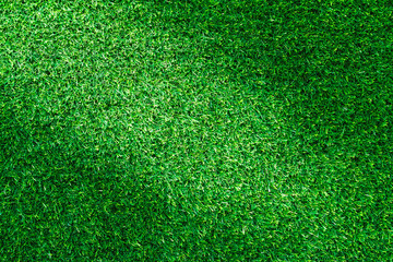 Fototapeta premium Artificial green grass texture for golf course, soccer field or sports background concept design.