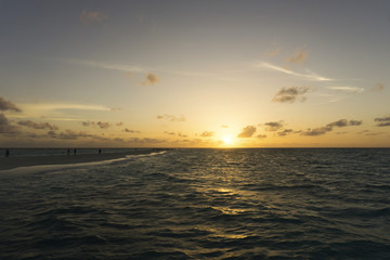 Dramatic sunset over tropical beach and sea