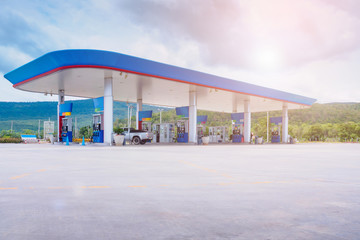 Gas fuel station with clouds in the sky and sun light