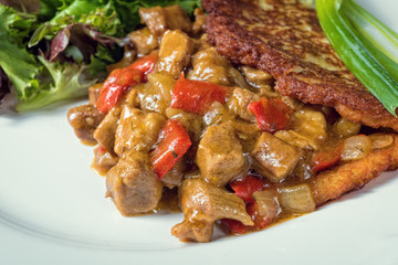 Hungarian goulash with potato pancakes