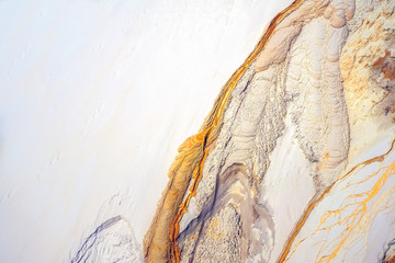 The golden river. Water streak on sand at abandoned kaolin quarry - obrazy, fototapety, plakaty