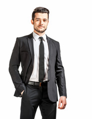 portrait of confident handsome man in black suit with bowtie