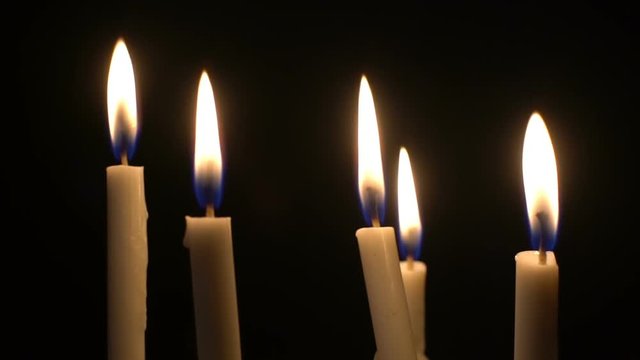 Burning candles get extinguished slow motion
