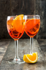 Aperol spritz cocktail in glass on wooden table
