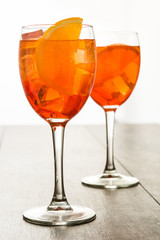 Aperol spritz cocktail in glass on wooden table

