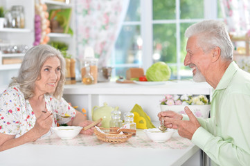 Beautiful elderly couple at breakfast