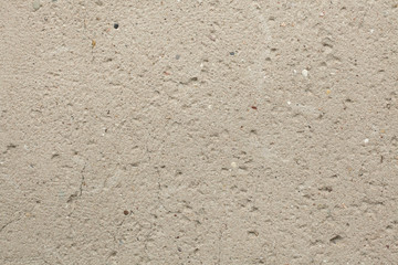 Rough unpainted concrete wall.