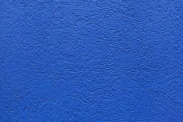 Blue painted stucco wall.