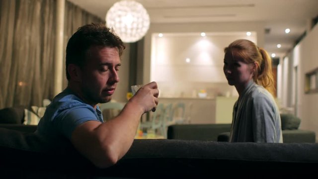 The social problem of alcoholism. Wife trying to stop husband from drinking, it won't work