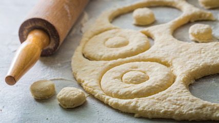 Cutting from fresh dough yummy and homemade donuts
