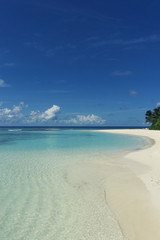 Tropical beach with clear sea and golden sand