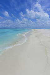 Tropical beach with clear sea and golden sand