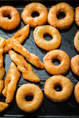 Sweet and hot golden donuts freshly baked