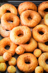 Yummy and homemade golden donuts freshly baked