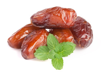 Dates with mint leaves isolated on white background