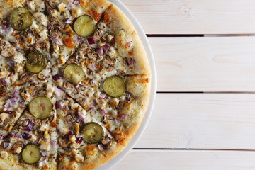 Pizza with onion, mushrooms and pickled cucumber