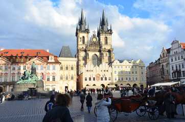 Tourists on The Old Town Market Square and Church of Our Lady Before T&yacute;n in Prague, Czech Republic