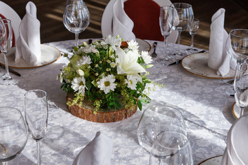 Table in a restaurant with bouquet of flowers