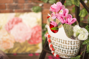 Isolated hanging basket shows a variety of pretty flowers
