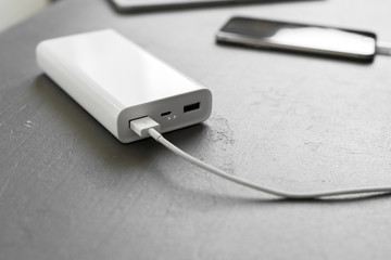 Fototapeta premium Smartphone charging with power bank