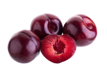 Fototapeta na wymiar ripe fresh plum with half and slice isolated on white background