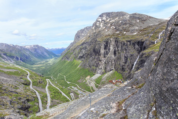 Trollstigen (English: Trolls' Path),a serpentine mountain road is national tourist route in , Norway. At 700 plateau there is car park and viewing balconies overlooking bends of this road