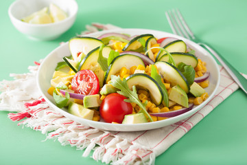 spiralized courgette salad with sweetcorn tomato avocado, healthy vegan meal