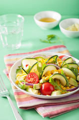 spiralized courgette salad with sweetcorn tomato avocado, healthy vegan meal