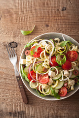 spiralized courgette salad greek style with tomato feta olives cucumber