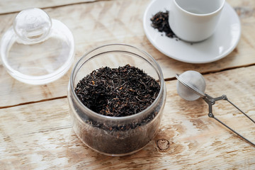 Tea set on the wooden table at sunny morning