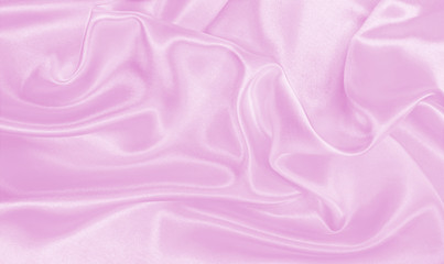 Obraz premium Smooth elegant pink silk or satin texture as wedding background. Luxurious background design
