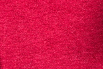 Close up of red handmade knitted fabric