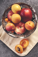 Sweet ripe peach in the bowl