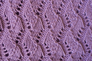 Relief pattern with perforations on handmade pink knitwork