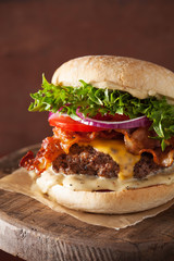 bacon cheese burger with beef patty, tomato, onion