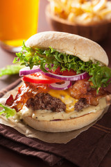 bacon cheese burger with beef patty tomato onion