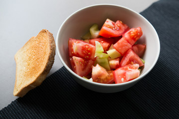 paprika tomato salad in gray bowl ready to eat 