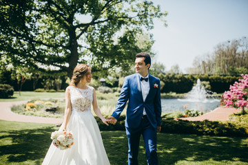 Very happy wedding couple at summer