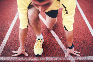 Runner on the start line. Sport, fitness, athletics concept